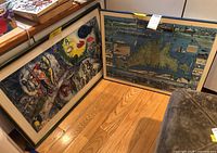 Both framed artworks leaning against wall: Chagall print left, Martha’s Vineyard map right