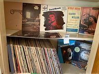 Shelf with visible LP spines and jackets plus “Saturday Night Fever” cover