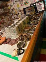Overall lot on bar counter showing steins, plaques, Labatt’s sign