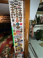 Full view of tall board displaying entire assortment of patches