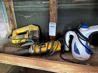 Overall lot showing die grinder, jigsaw, garment steamer