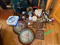 Overview of entire lot showing plates, carvings, candles, candlesticks, sconces, tree, oils