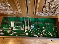 Drawer view showing majority of flatware pieces arranged