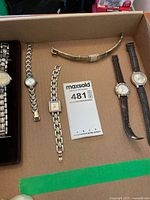 Box containing six ladies wristwatches displayed