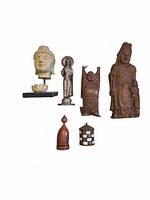 Overall view of six Asian decorative pieces