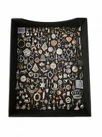 Full tray view showing entire assortment of charms