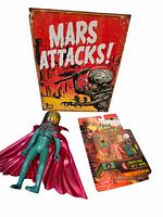Group shot of metal sign, loose action figure and sealed figure