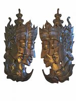 Both Balinese wood plaques side by side