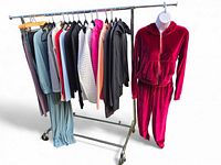 Full rack of assorted athleisure garments and velour tracksuit on mannequin