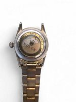 Back of Rolex wristwatch showing case back inscription and bracelet