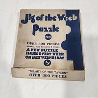 Top of puzzle box showing title, issue number, piece count and price