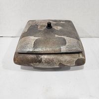 Top view of square raku container with lid in place