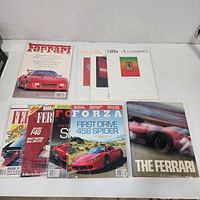 Overall view of all nine Ferrari publications laid out