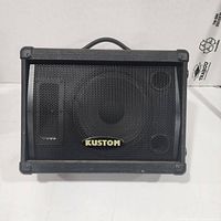 Front view of Kustom KSC10M monitor showing grille and logo