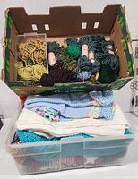 overview of yarn box atop bin of folded blankets