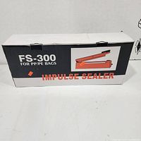 Closed retail box labeled FS-300 Impulse Sealer for PP/PE bags