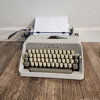 Front view of Adler J4 typewriter with paper loaded