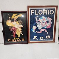 Both framed wine advertising prints side by side