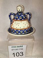 Front view of ceramic butter dish showing pattern and overall form