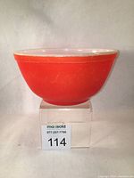 Front profile of red Pyrex mixing bowl showing overall condition