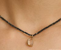 Necklace on model showing bead strand and pendant