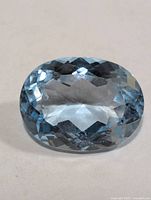 Top view of faceted blue topaz gemstone