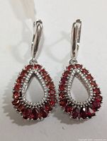 Front view of both earrings showing stone arrangement