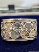 Front view showing diamond slices set all around silver band