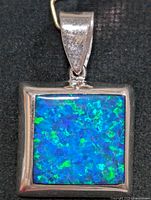 Front view showing opalite cabochon and silver bezel