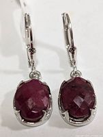 Front view of both earrings showing rubies and silver setting