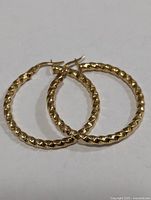 Pair of textured silver hoop earrings