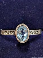 Front view showing oval blue topaz and marcasite shoulders