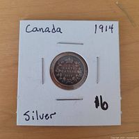 Reverse of 1914 Canada 5 Cents coin in flip