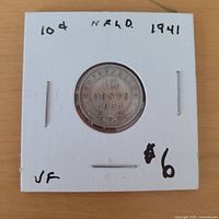 Reverse view showing denomination, date, holder markings