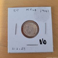 Obverse view of the 1941 Newfoundland 5¢ coin in cardboard flip mount