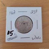 reverse side showing bobcat design and 25 CENTS legend