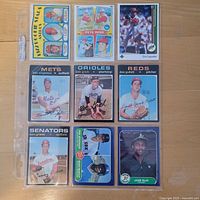 Fronts of all nine baseball cards in sleeve