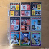 Front view of nine baseball cards in plastic sheet
