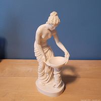 Front view of white A. Santini woman with basin sculpture