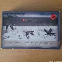 Outer cardboard sleeve showing 2004 specimen set information