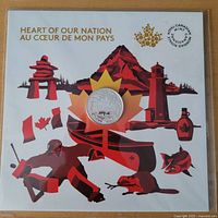 Front of presentation card showing coin and Canada 150 artwork