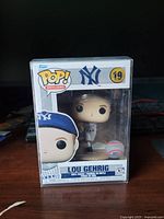 Front view of boxed Lou Gehrig Funko Pop with protector