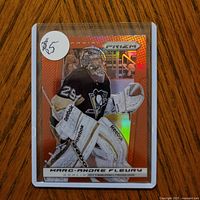 Front of 2013-14 Panini Prizm Marc-Andre Fleury red parallel card in sleeve