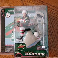 Front view of sealed Marian Gaborik action figure in packaging