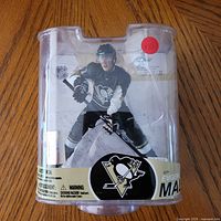 Front view of sealed McFarlane Series 17 Evgeni Malkin action figure packaging