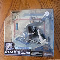 Front view of sealed Nikolai Khabibulin Series 6 figure showing player, accessories and branding
