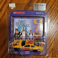 Front view of packaged 1:64 diecast car with Wizard of Oz card