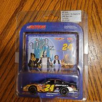 Front view of sealed blister-packed die-cast car with Wizard of Oz backing card