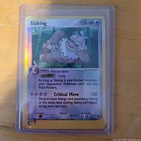 Front of Slaking reverse holo card in top-loader