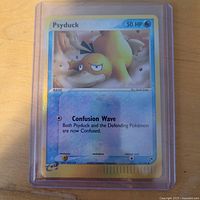 Front of Psyduck reverse holo card in sleeve showing 50 HP, Confusion Wave attack, e-Reader symbol